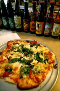 Pizza & Beer that can be purchased with ELMs at the Milkweed Mercantile