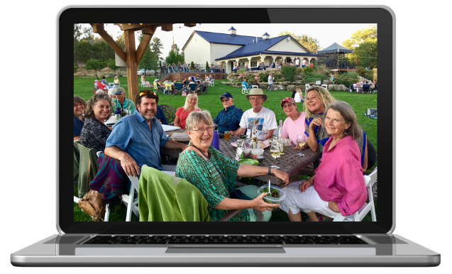 Community sitting outside in a computer frame