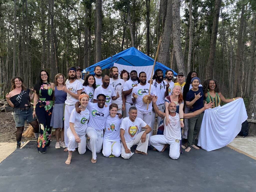 Group of diverse people gathered outdoors at Foundation for Intentional Community.
