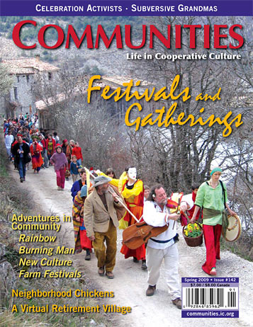 People participating in a community festival parade in a snowy village setting.