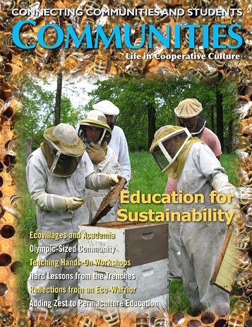 Group of people in beekeeping suits working with bees outdoors.