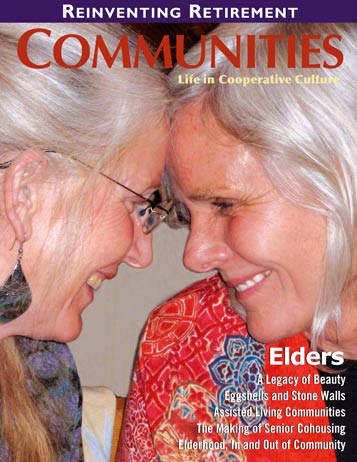 Two elderly women smiling and touching foreheads in a close-up photo.