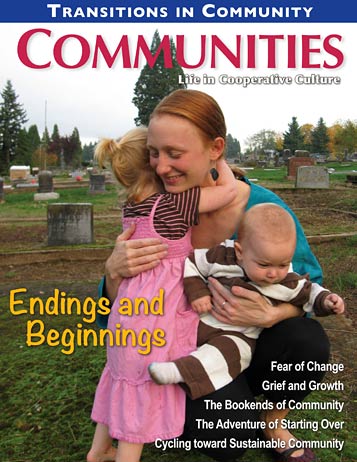 Woman with two children in a cemetery, embracing each other.