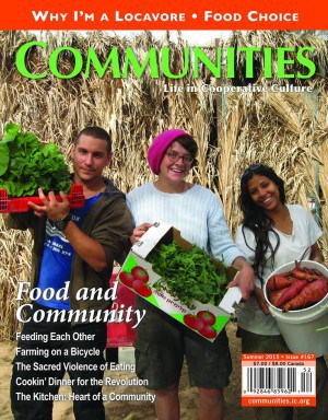Group of diverse people holding fresh vegetables in a community garden.
