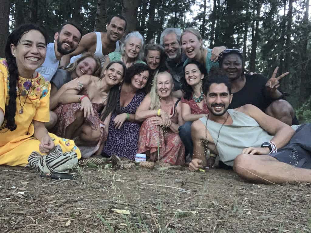 Group of diverse people smiling outdoors at the GEN Europe Gathering 2023.