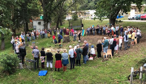 Community gathering at Narara Ecovillage for environmental awareness.