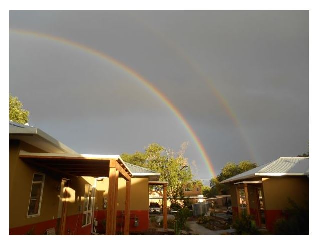 Double rainbow over community homes at Foundation for Intentional Community.