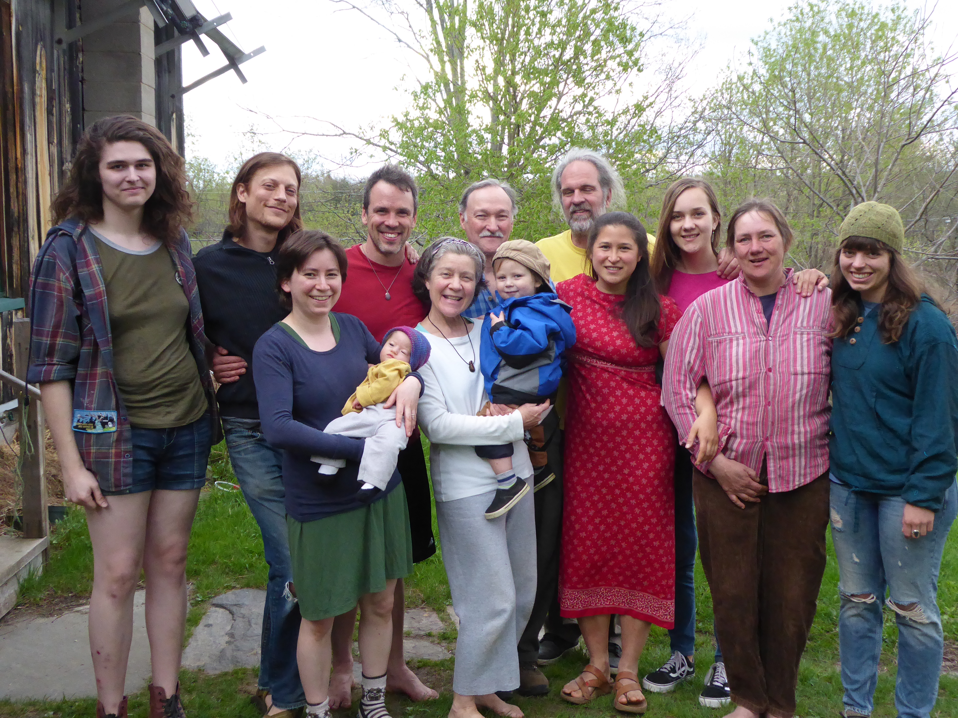 Group of diverse people outdoors at Birdsfoot Farm, smiling and enjoying nature.