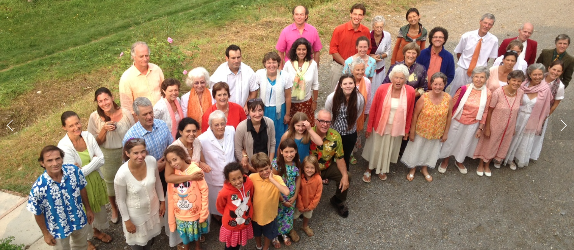 Group of diverse people gathered outdoors for community event at Foundation for IntentionalCommunity.