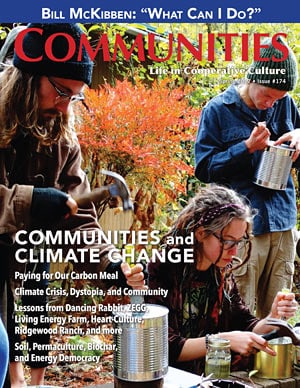 People enjoying outdoor community gathering in autumn setting.