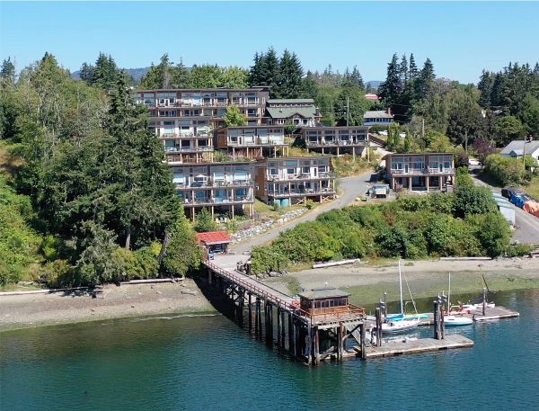 Harbourside cohousing community with waterfront view and docked boats.