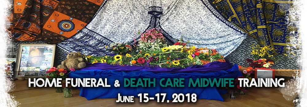Home funeral and death care midwife training event with floral display and decorative fabrics.