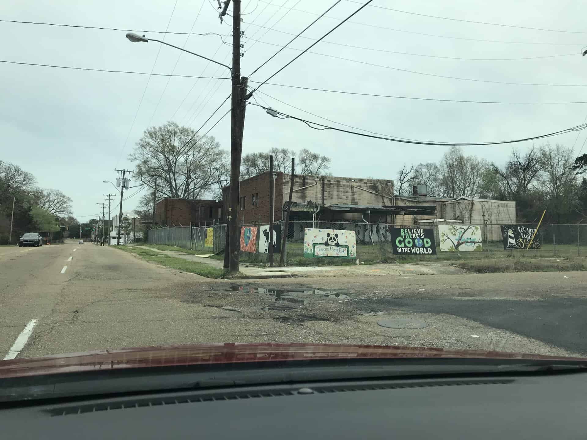 Urban street scene with old buildings and utility poles in Jackson, MS.
