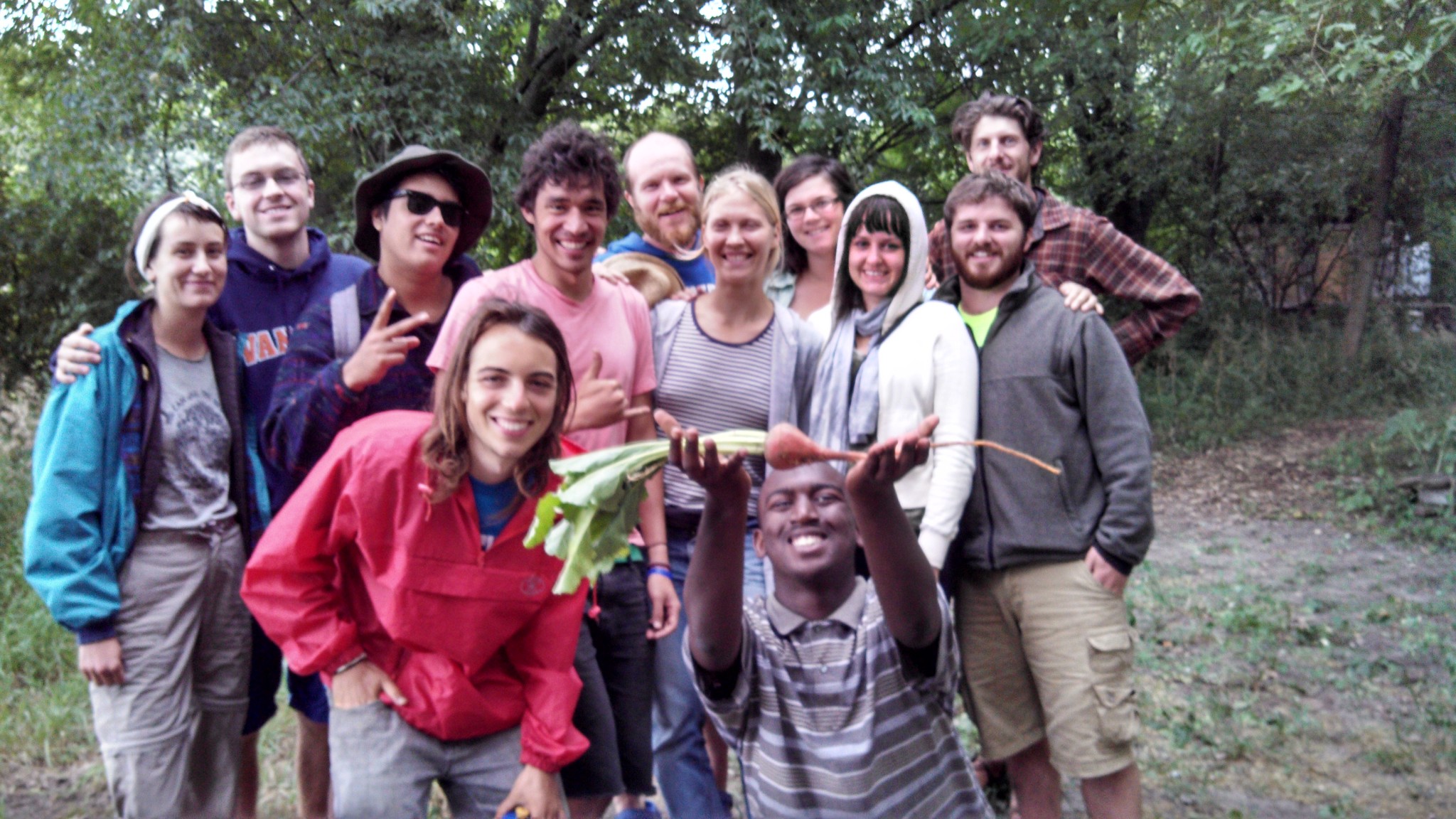 Group of diverse people outdoors at Foundation for Intentional Community event.