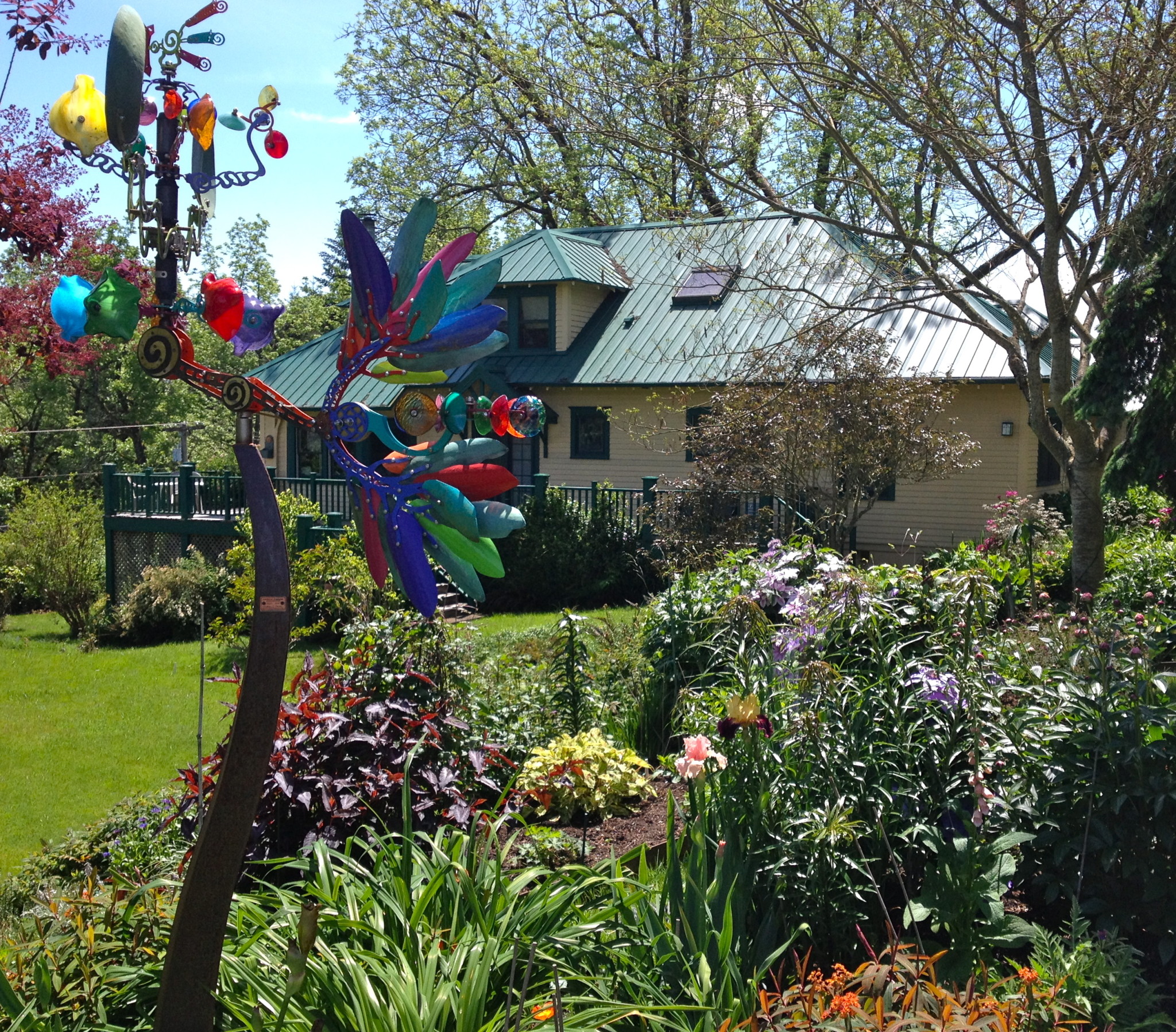 Colorful garden sculpture in Green Grove Cohousing Community yard.