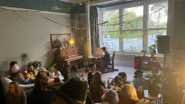 Community gathering at Windrose House with live music and socializing.