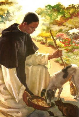A person in traditional clothing tending to animals in a lush garden setting.