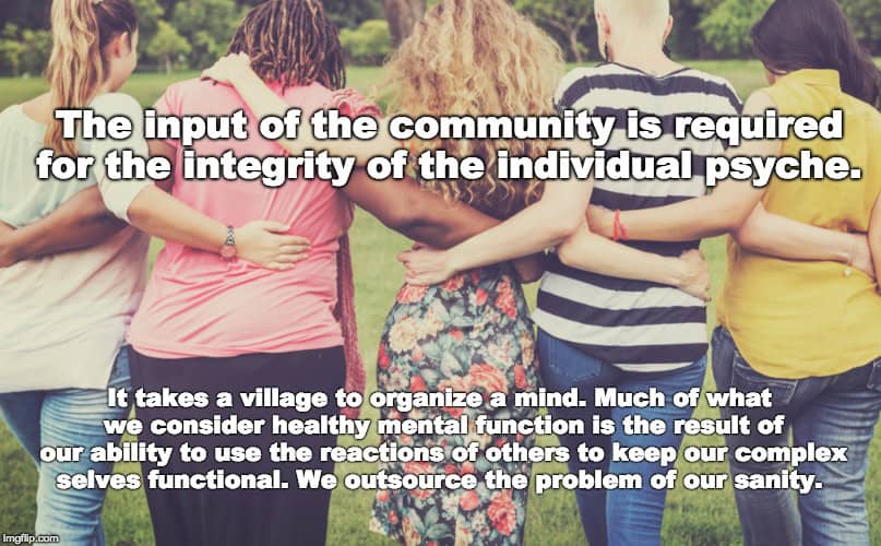 Group of diverse people with arms around each other outdoors for community and mental health.