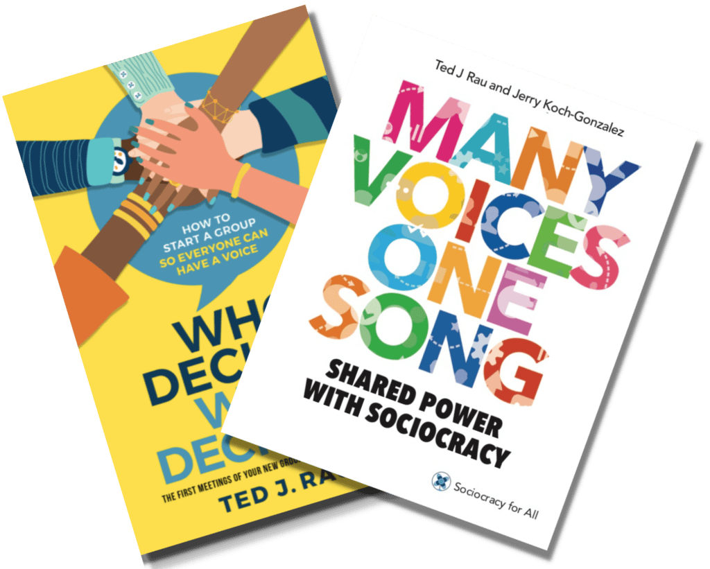 Books on sociocracy and community building with colorful covers.