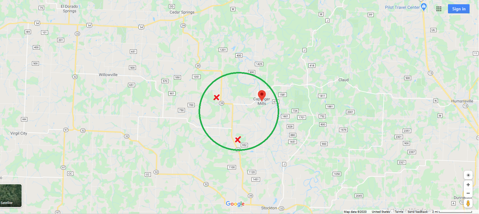 Map showing a central location with a green circle and red markers.