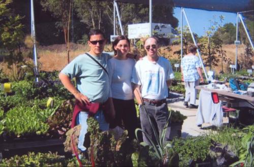 People at a community garden or outdoor event in California.