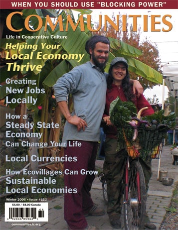 Two people with a bicycle and fresh produce in a community setting.