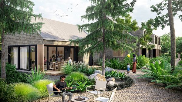 Modern eco-friendly community house surrounded by lush greenery and outdoor seating.