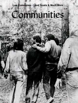Group of people walking outdoors in a natural setting, seen from behind.