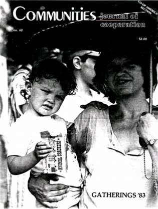 Black and white photo of children and adults at a community gathering in 1983.