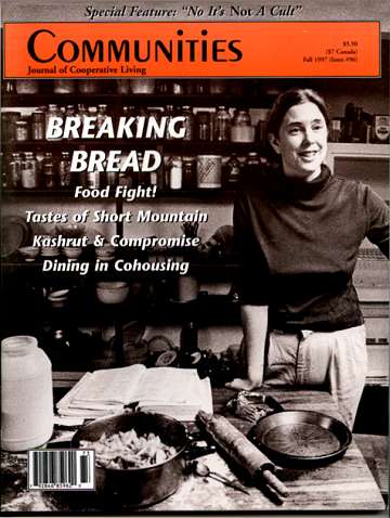 Cover of Communities Magazine Fall 1997 featuring a woman in a kitchen.