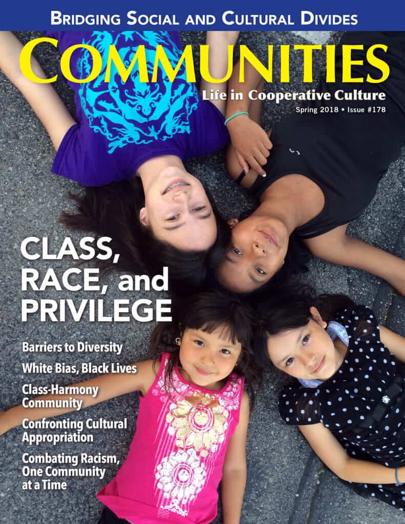Diverse children lying on the ground, smiling, representing community diversity.