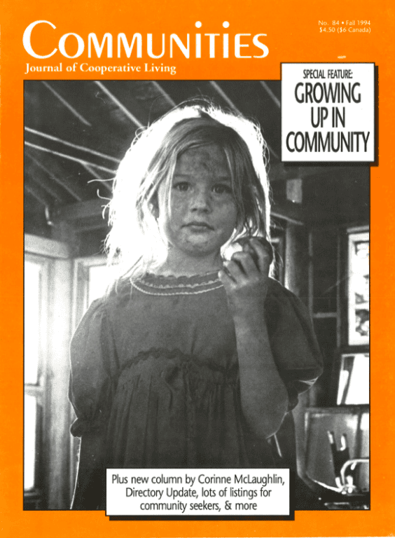 Black and white photo of a young girl with messy hair holding an apple.
