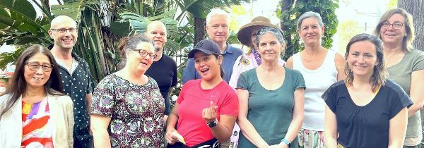 Group of diverse people outdoors at Sydney Urban Eco-Village event.