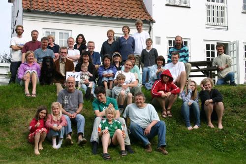 Group photo of diverse community members at Foundation for Intentional Community event.