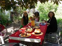 Diverse group enjoying outdoor community gathering at eco-village.