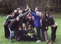 Group of diverse people celebrating outdoors at Oakleigh Meadow Cohousing.