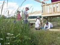 Community members planting and caring for a garden at Foundation for Intentional Community.