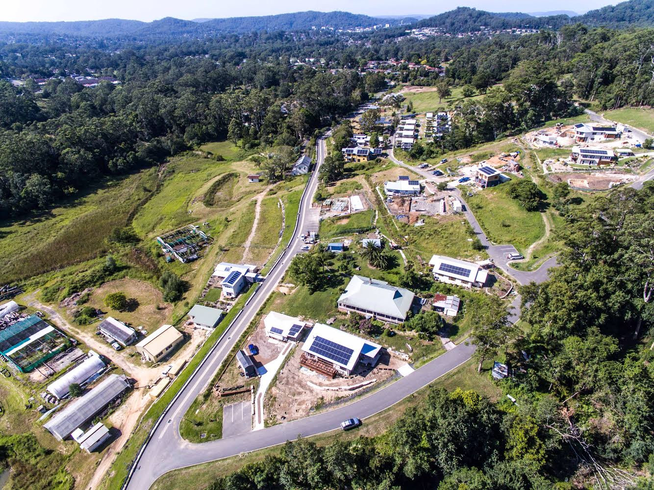 Aerial view of Narara Ecovillage with sustainable homes and green spaces.