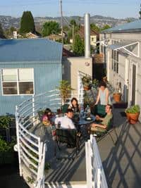 Community gathering on rooftop deck at Foundation for Intentional Community.