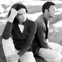 Two people sitting outdoors, engaged in conversation, representing community connection.