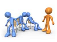 Group of blue and orange 3D figures in a discussion or meeting setting.