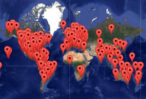 Global map with numerous red location markers indicating worldwide communities.