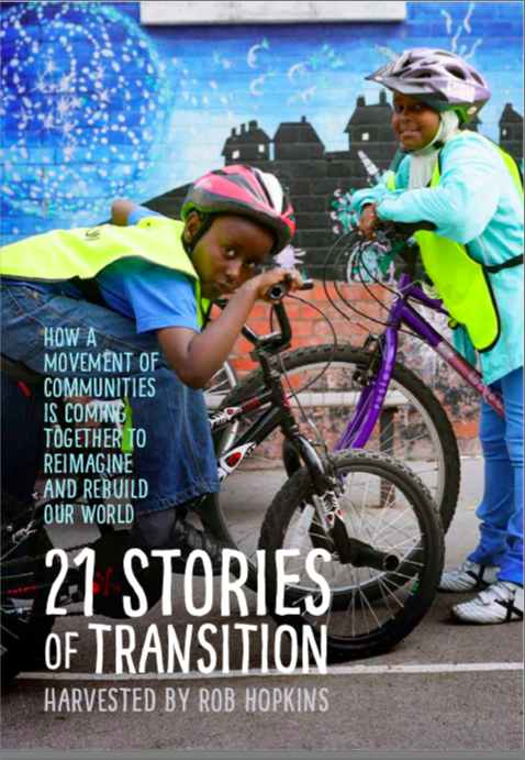 Children with bikes at community event promoting transition and rebuilding.