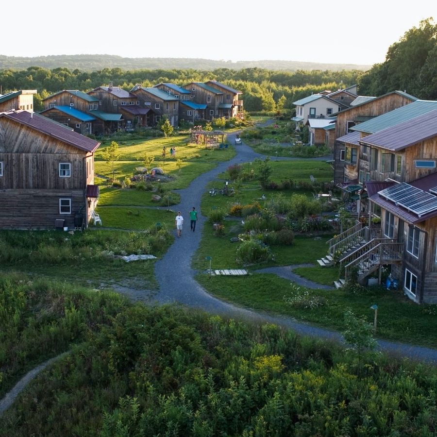 Eco-friendly community houses with gardens and walking paths.