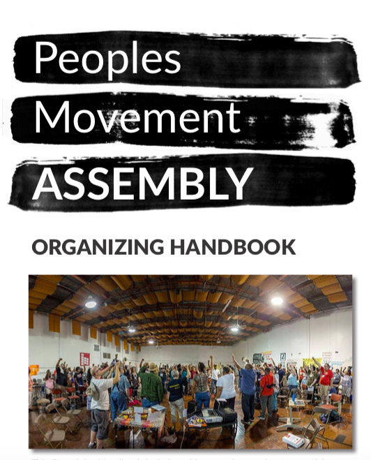 Large gathering of people at a community organizing event in a spacious hall.