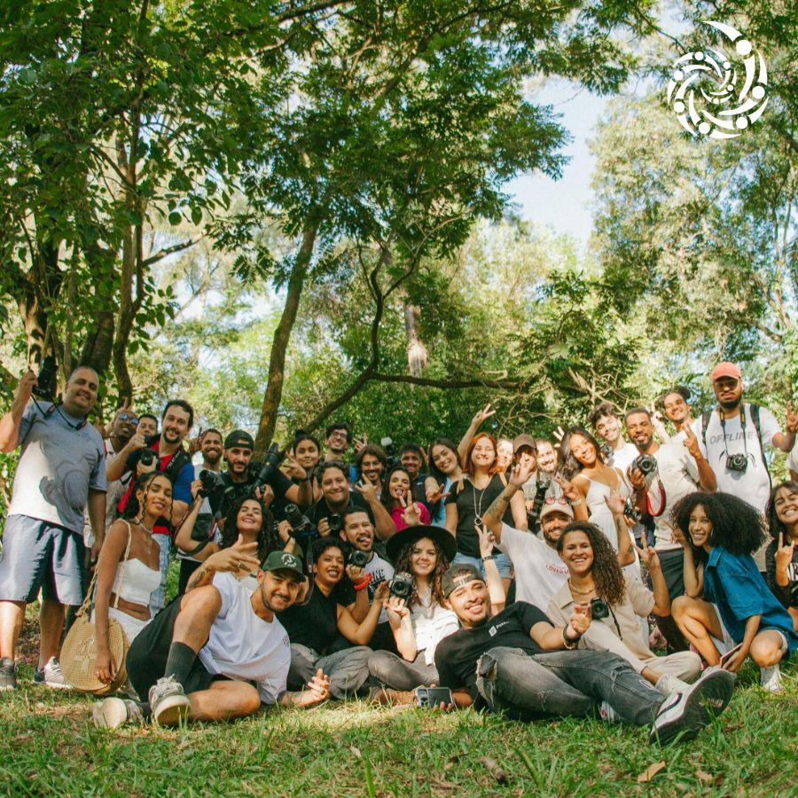 Group of diverse people enjoying outdoor community event in nature.