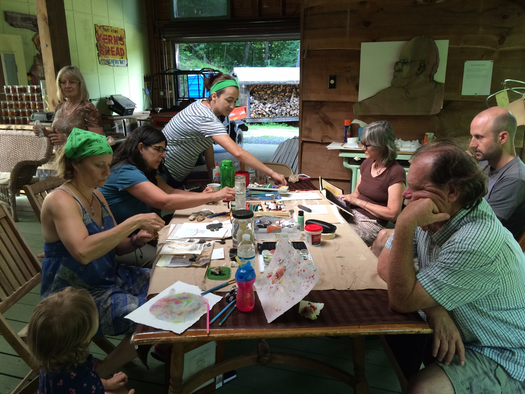 Group of people engaged in arts and crafts at a community workshop.