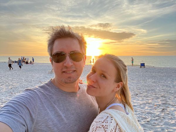 Couple enjoying sunset at the beach during Chesbro community event.