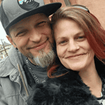 Happy couple at Foundation for Intentional Community event or gathering.