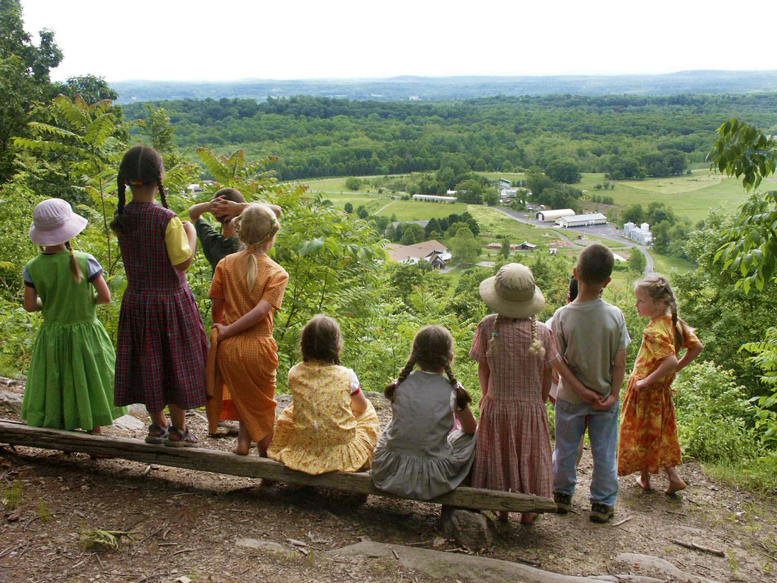 Children overlooking scenic landscape at Maple Ridge Bruderhof community.